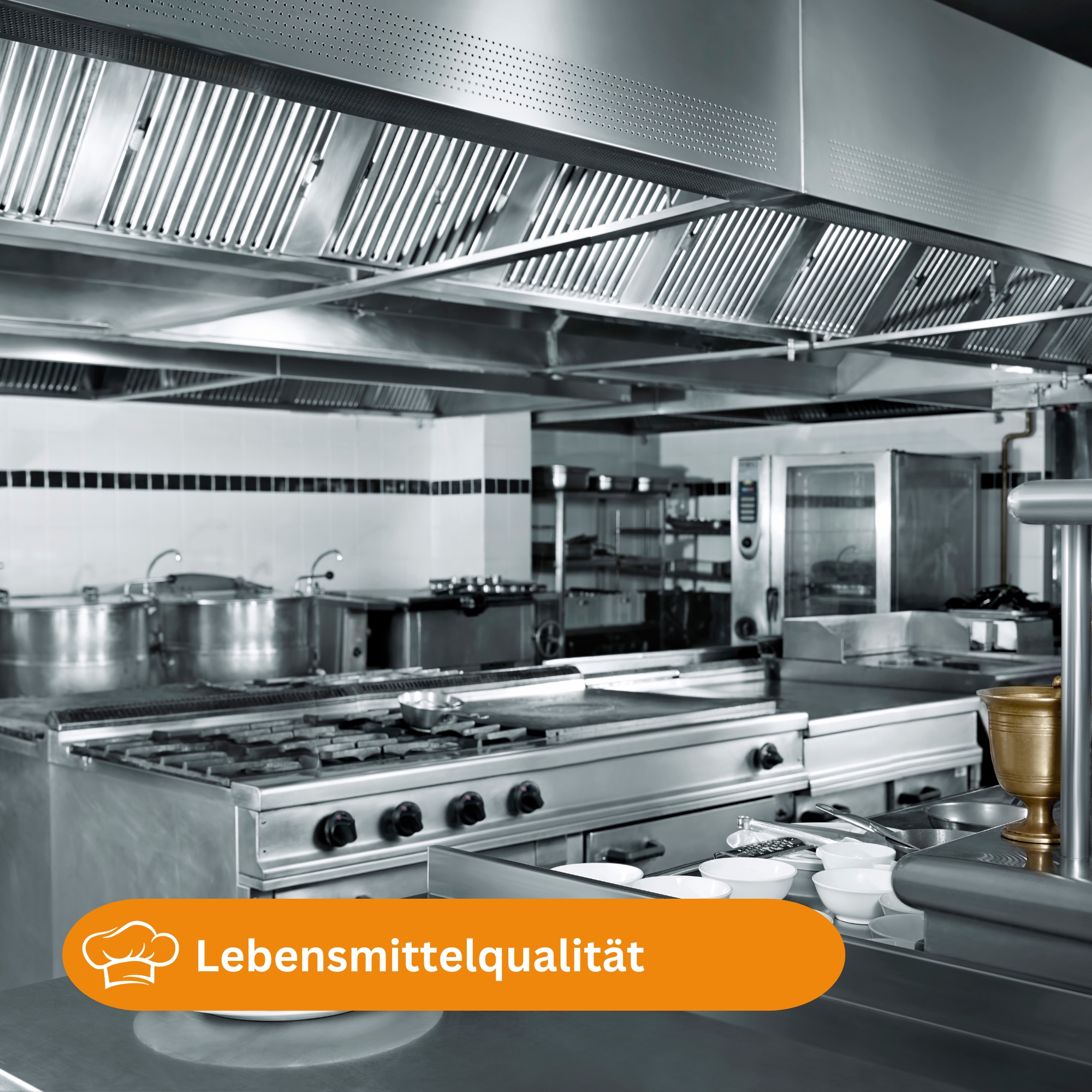 services-02 An industrial kitchen setup featuring hanging pans and a modern stove in Ankara, Türkiye.