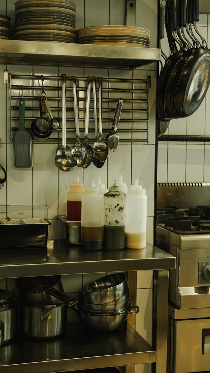 The Art of Drawing Readers In: Your attractive post title goes here A modern industrial kitchen with stainless steel cookware and utensils, highlighting contemporary design.